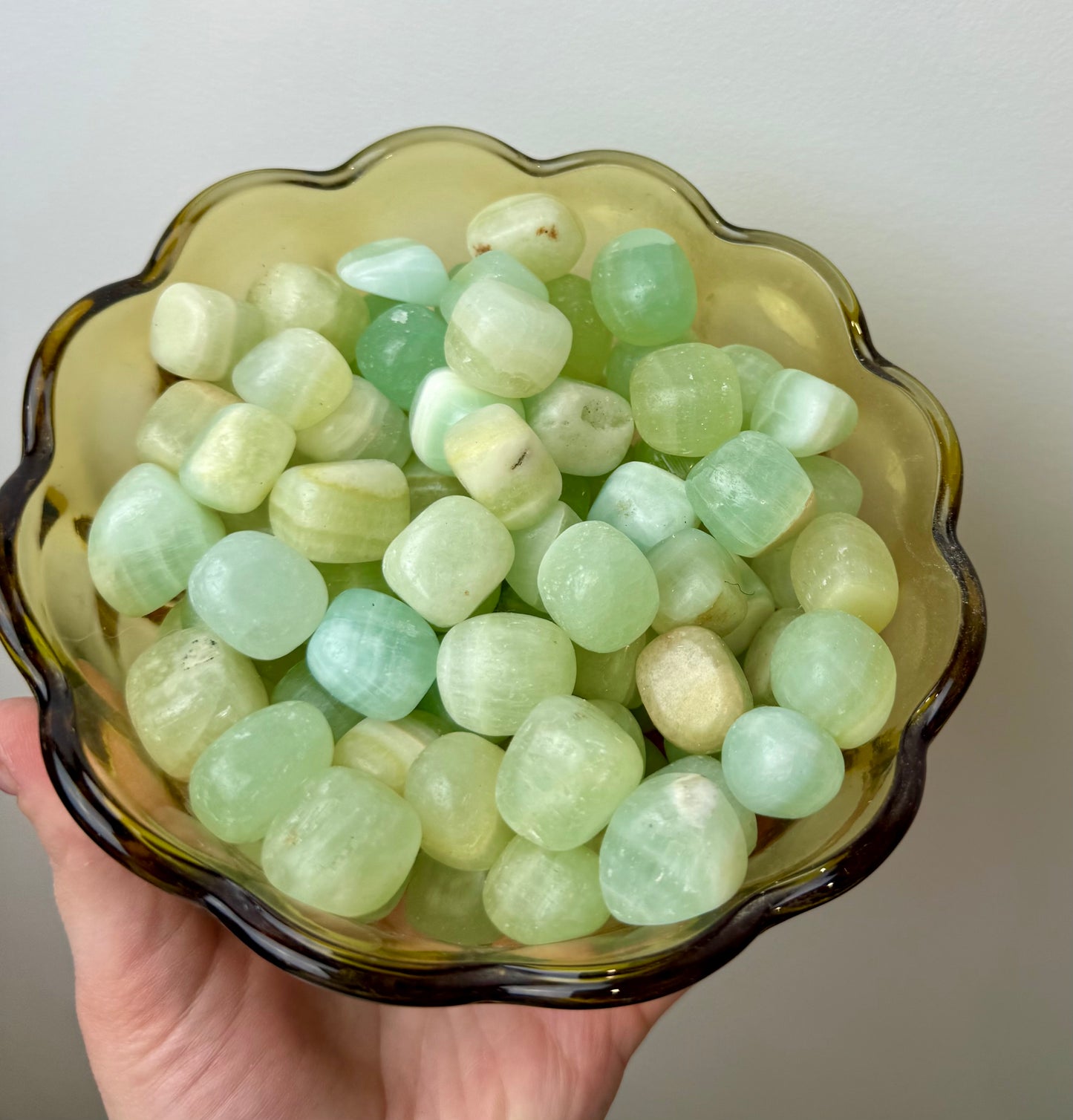 Pistachio green calcite tumbles