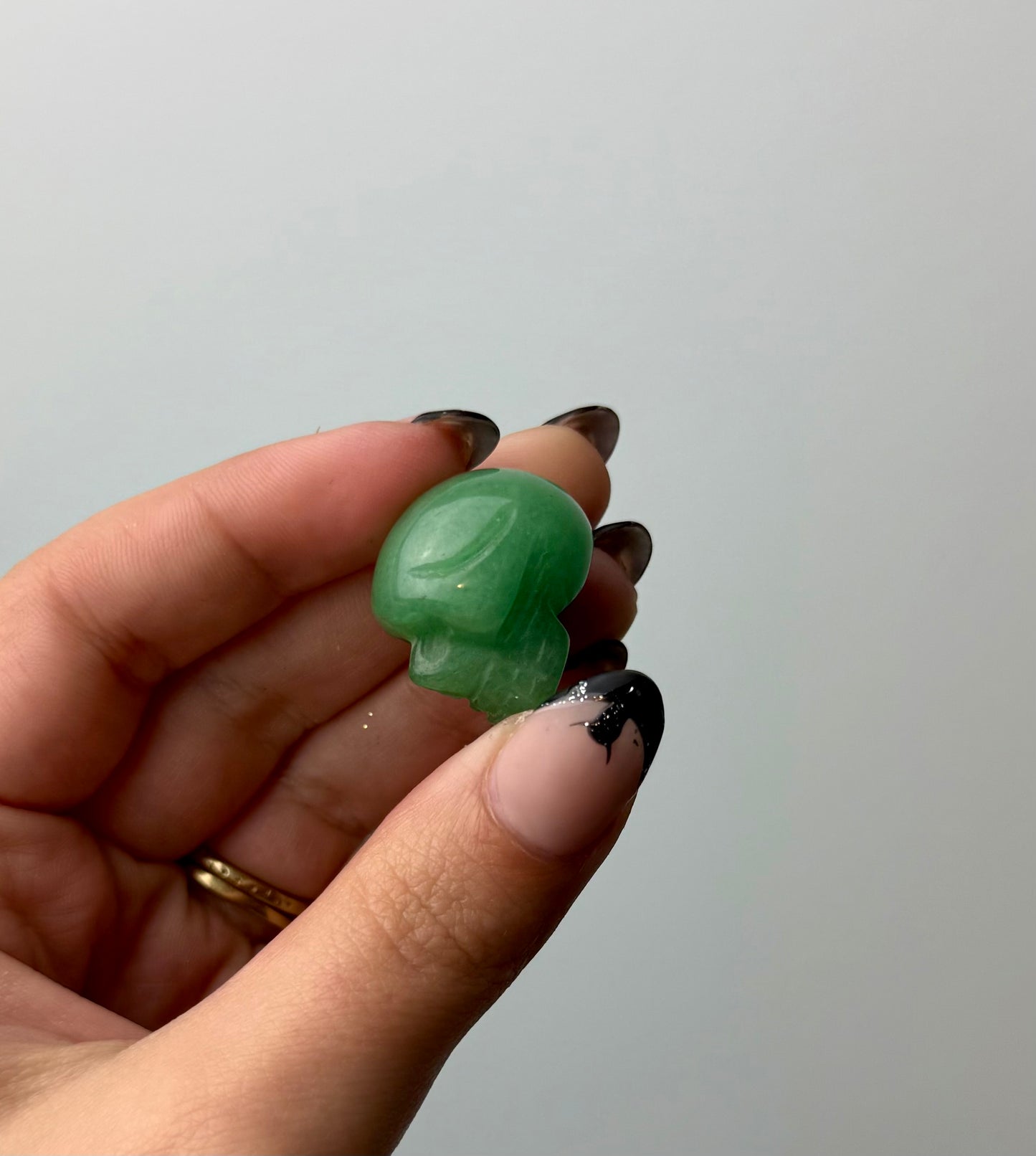 Green aventurine skull carving