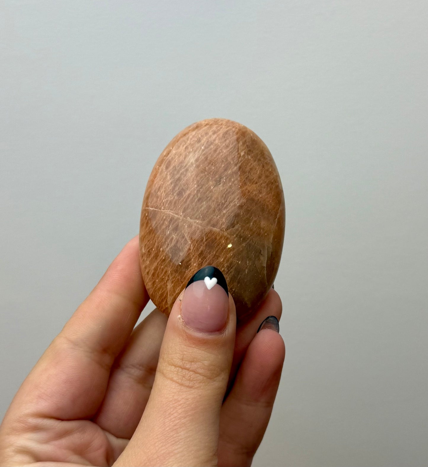 Peach moonstone palm stone