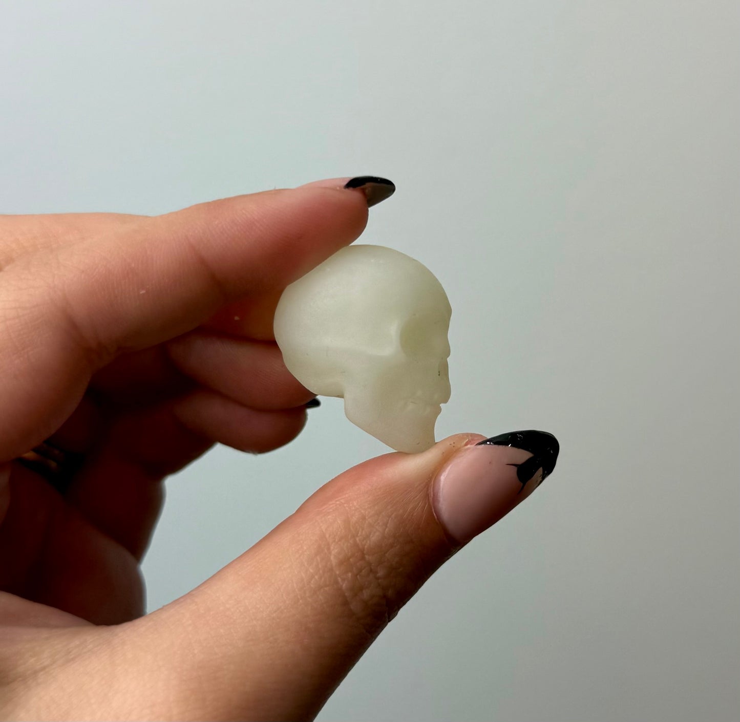 Green calcite “green onyx” skull carving