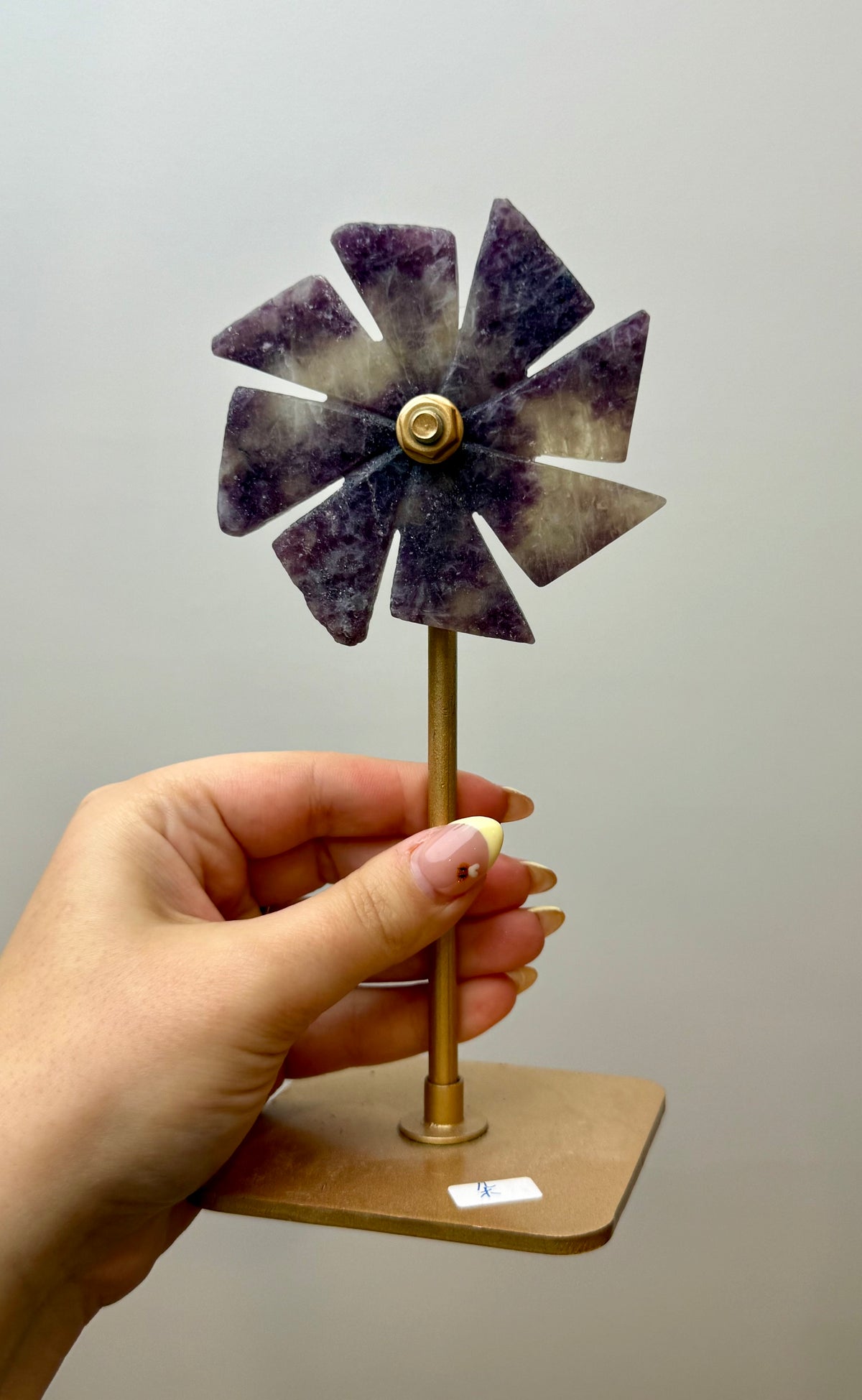 Lepidolite spinning windmill carving on a stand