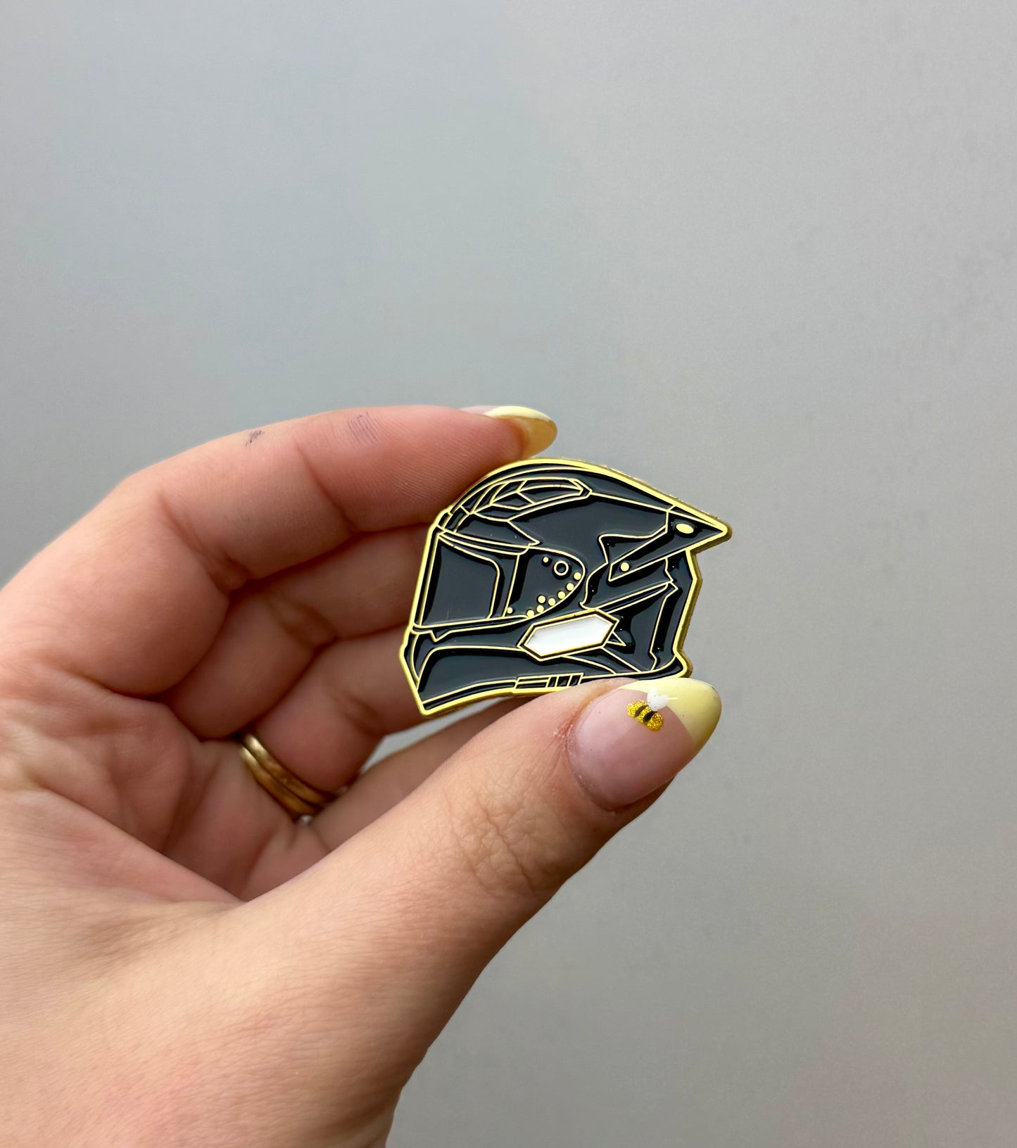 Black motorcycle helmet enamel pin 