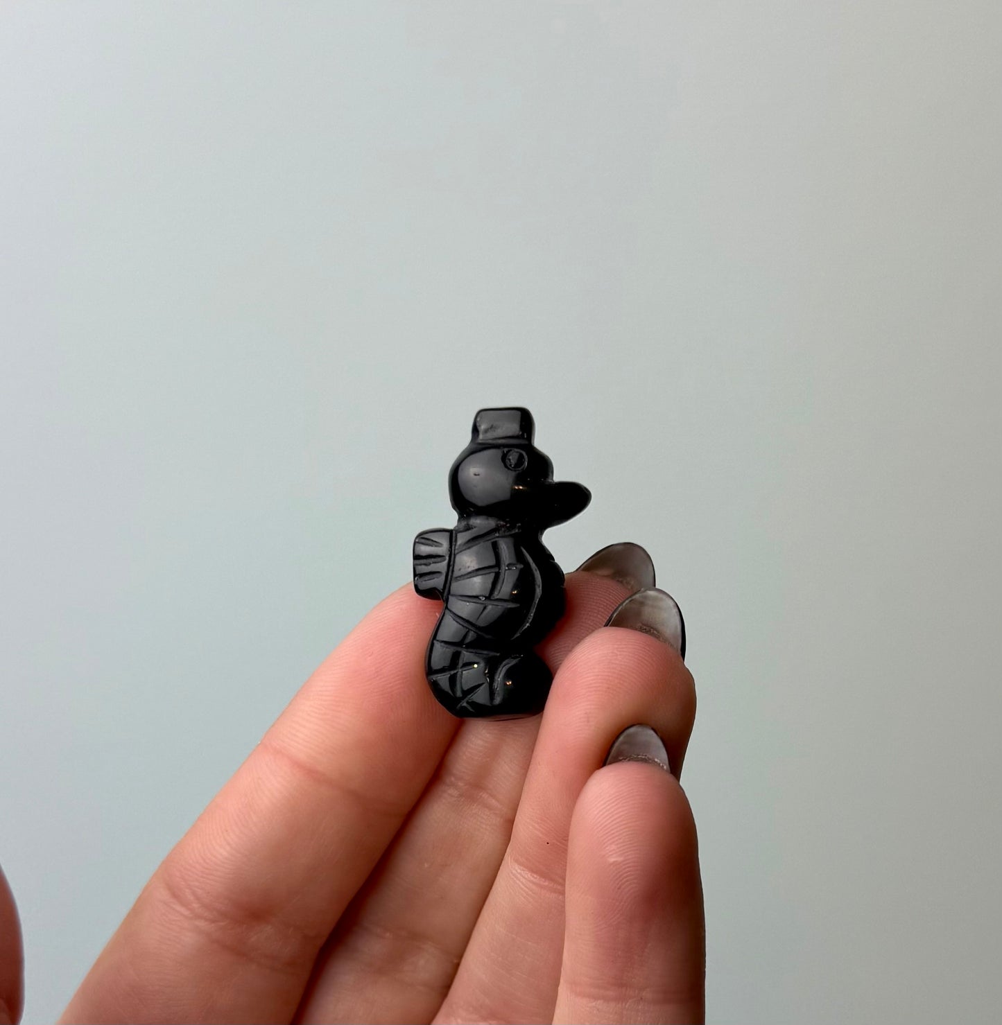 Obsidian seahorse carving