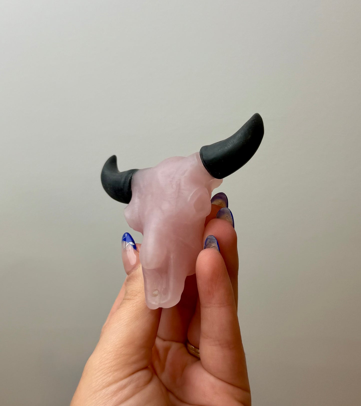 Rose quartz cow skull carving
