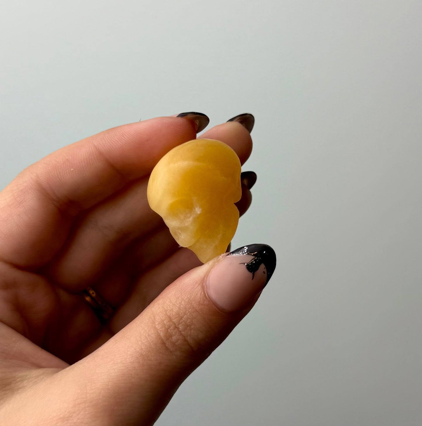Orange calcite skull carving