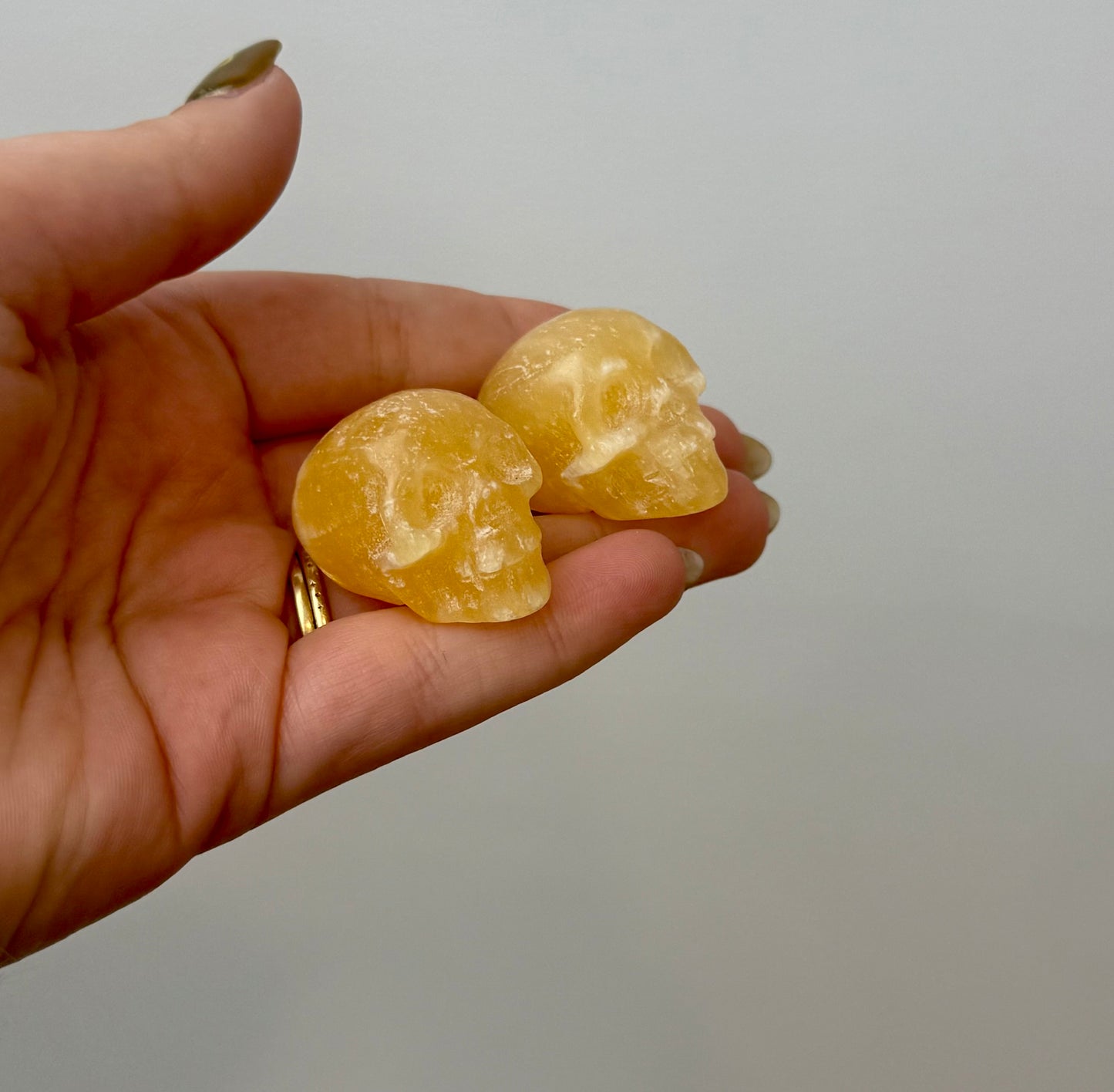 Orange calcite skull carvings