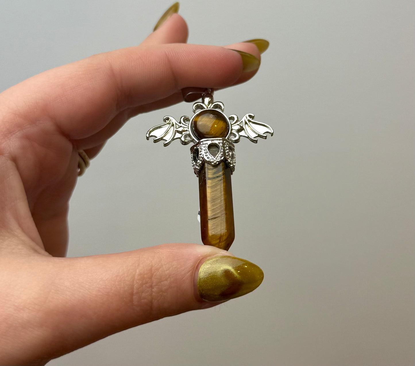 Tigers eye bat wing pendant