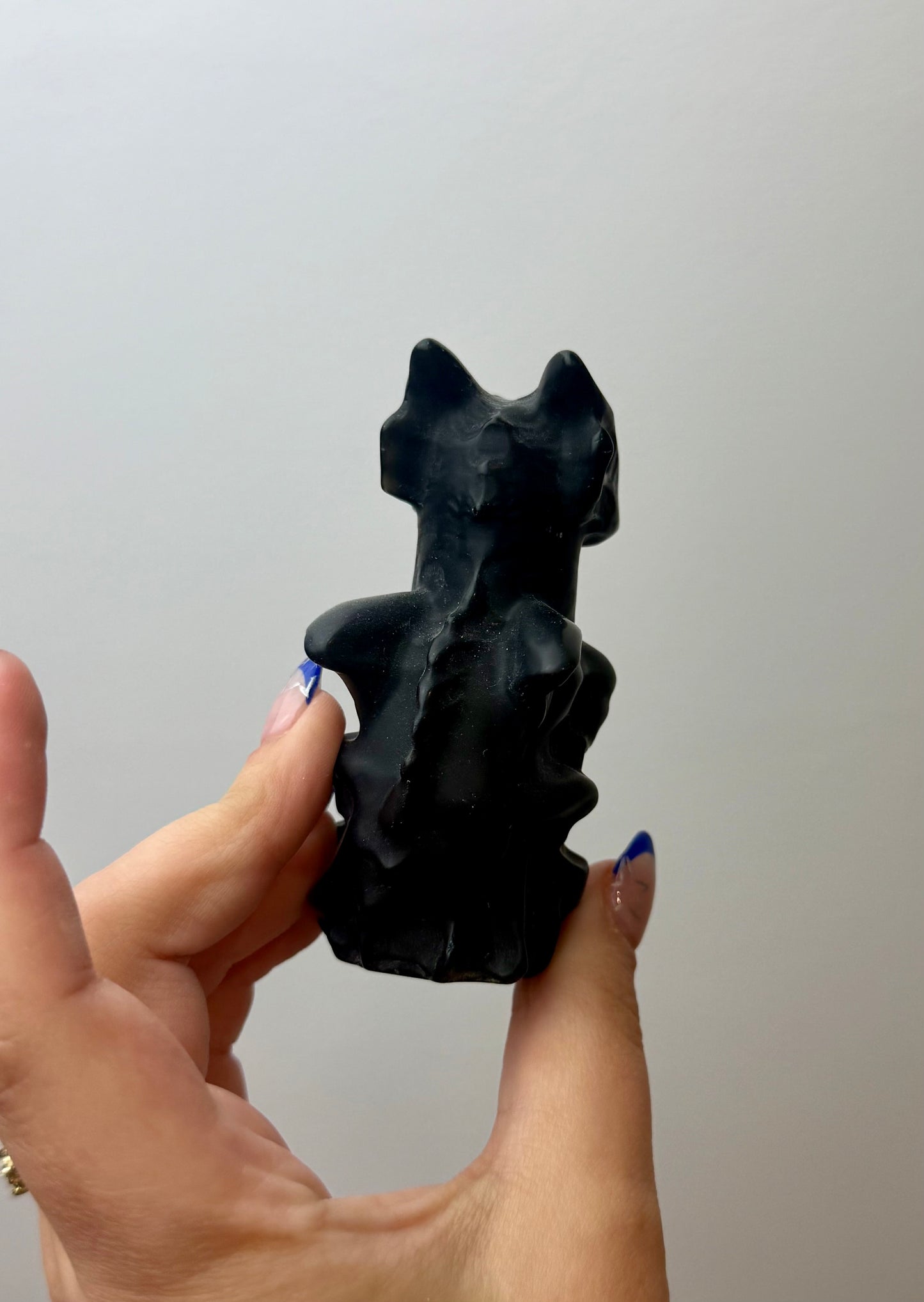 Obsidian dragon carving