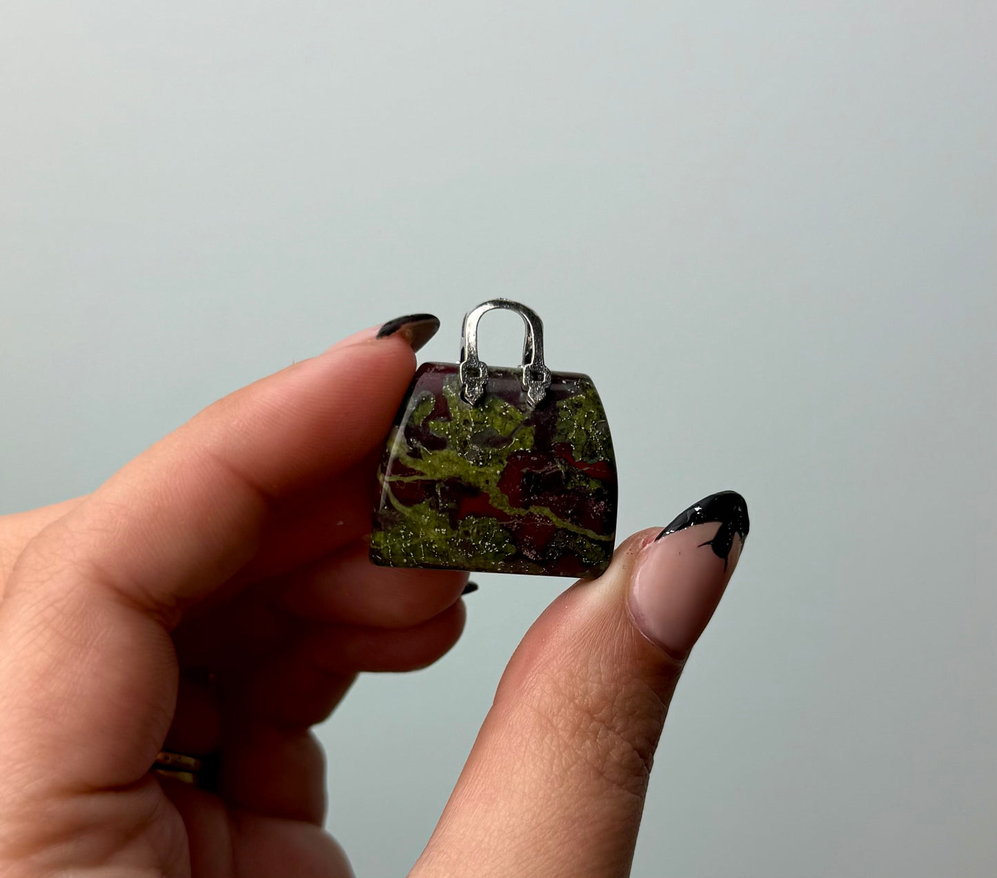 Dragon blood jasper purse carving