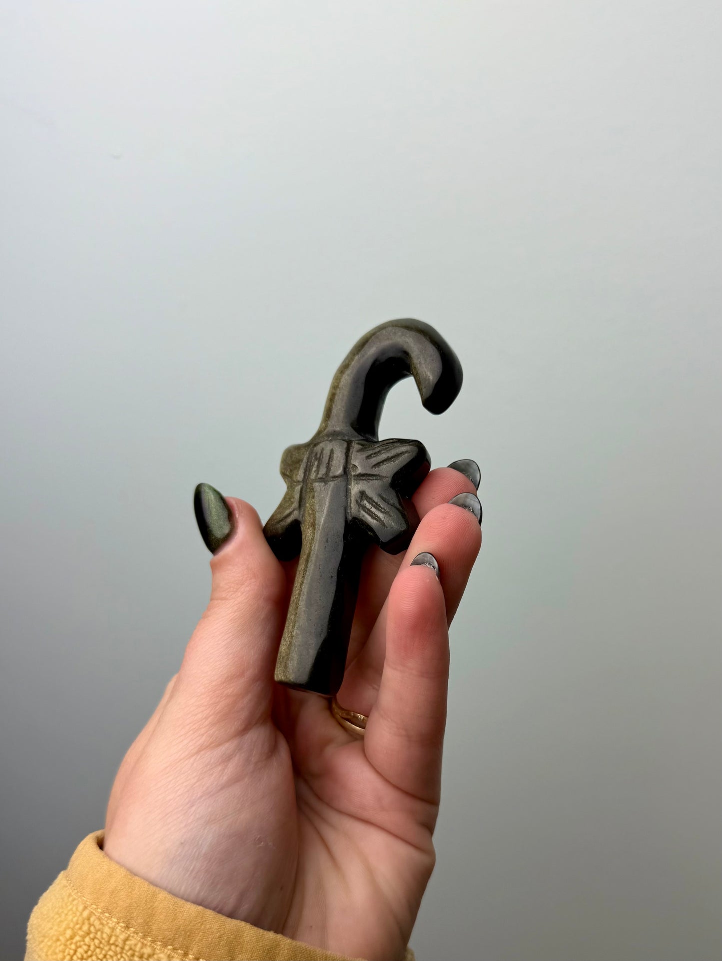 Gold sheen obsidian candy cane carving