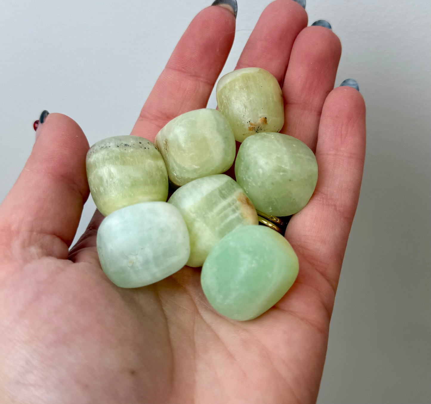 Pistachio green calcite tumbles