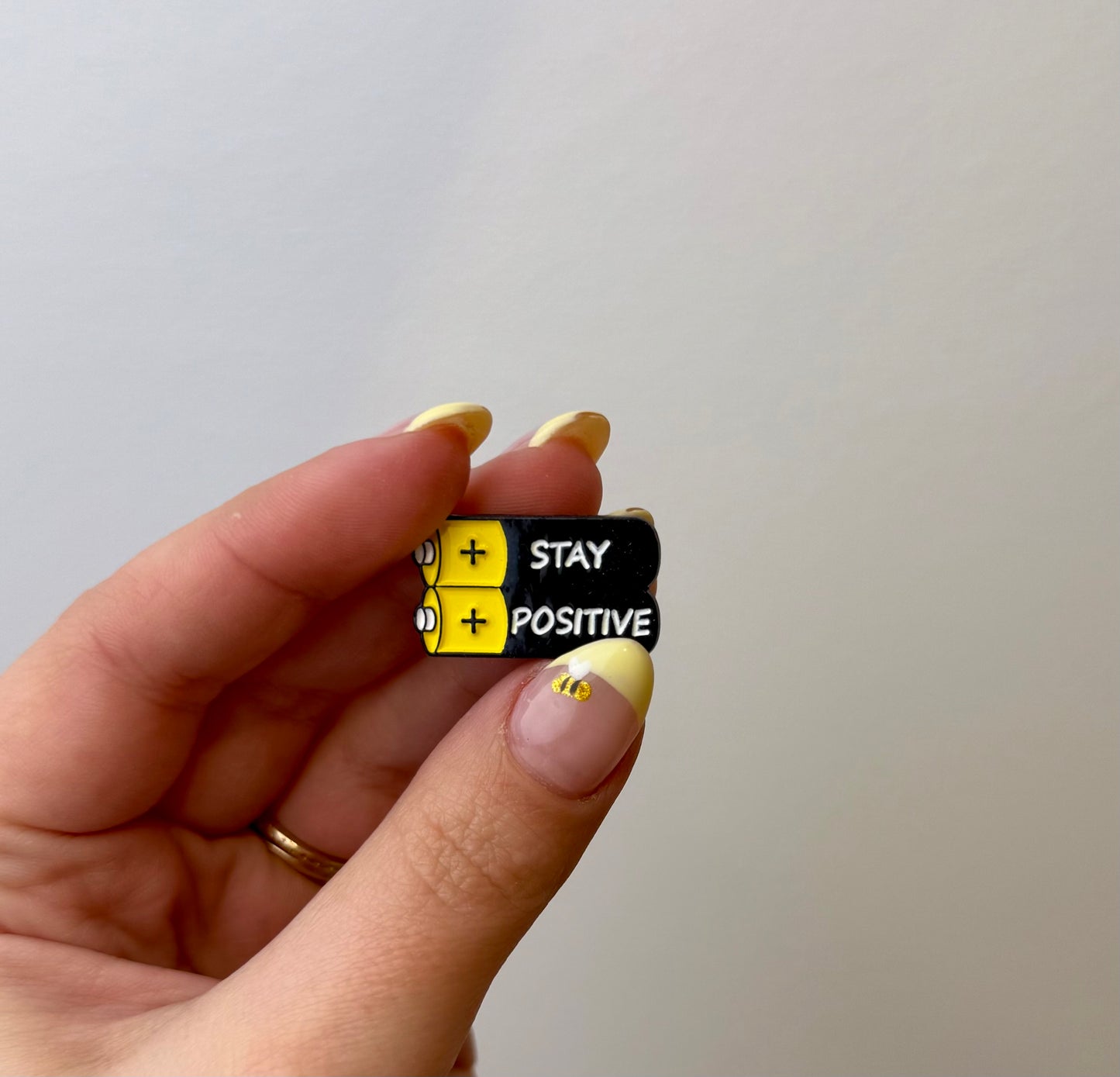 Stay positive enamel pin