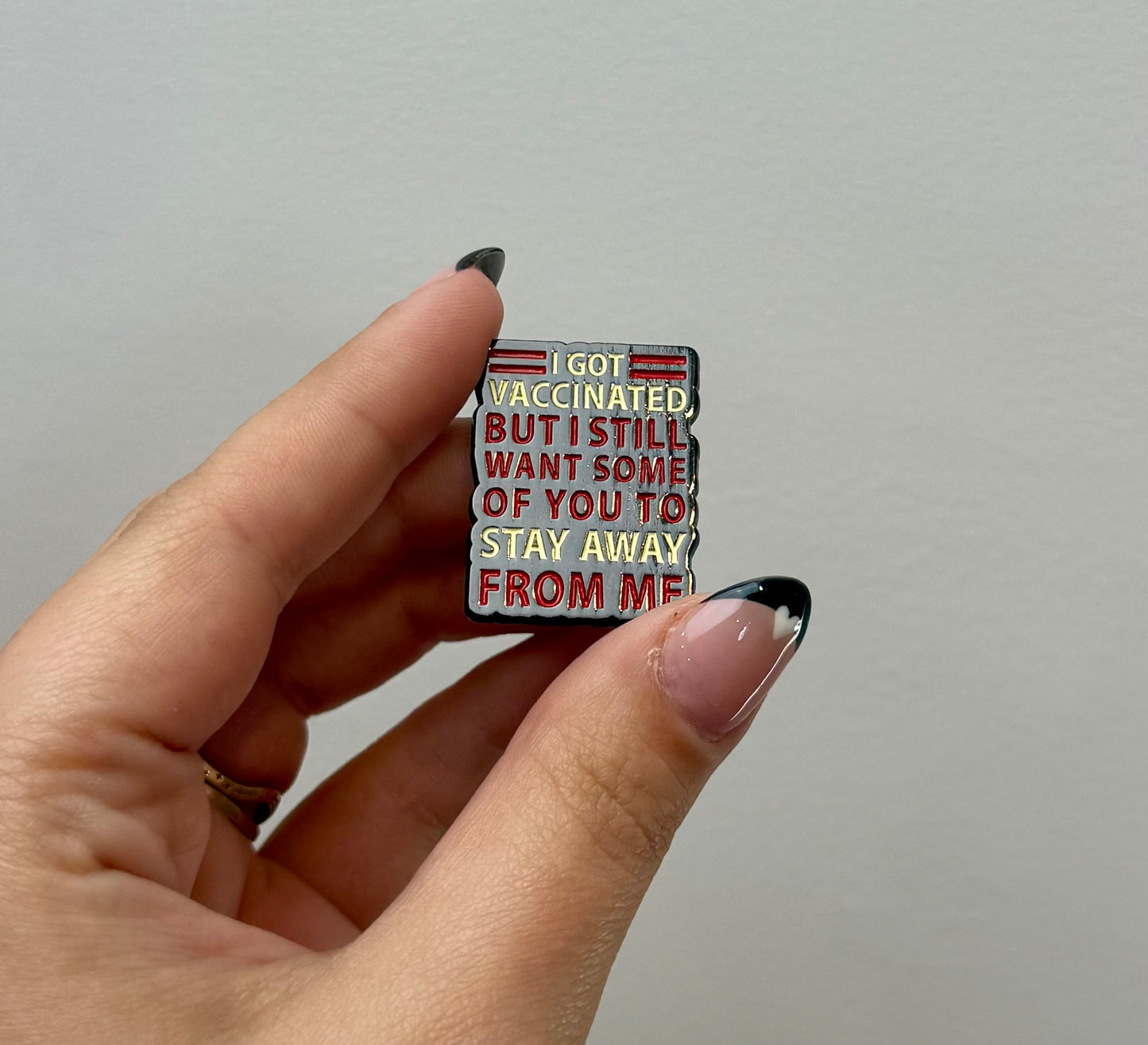 Vaccinated enamel pin