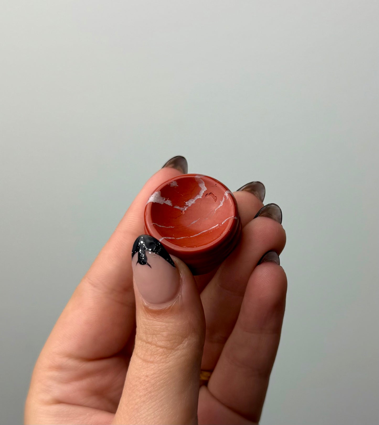 Red jasper sphere stand