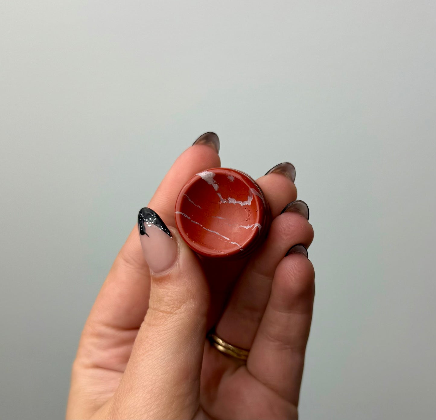 Red jasper sphere stand