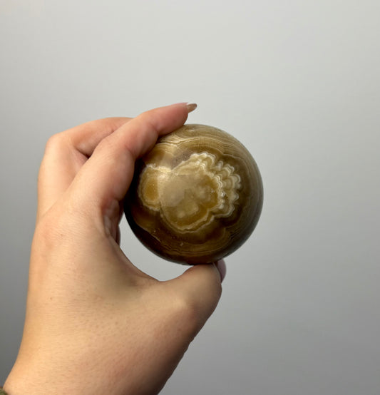 Amber calcite sphere