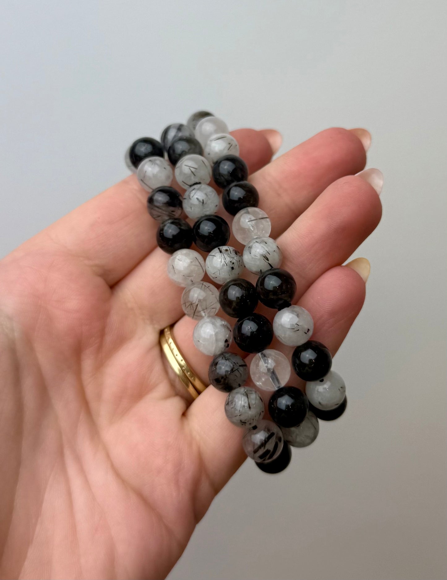 Black tourmaline in quartz bracelets