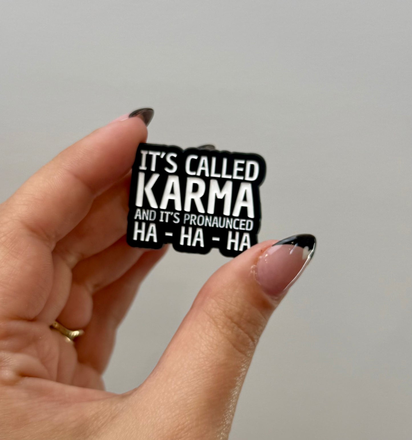 Karma enamel pin