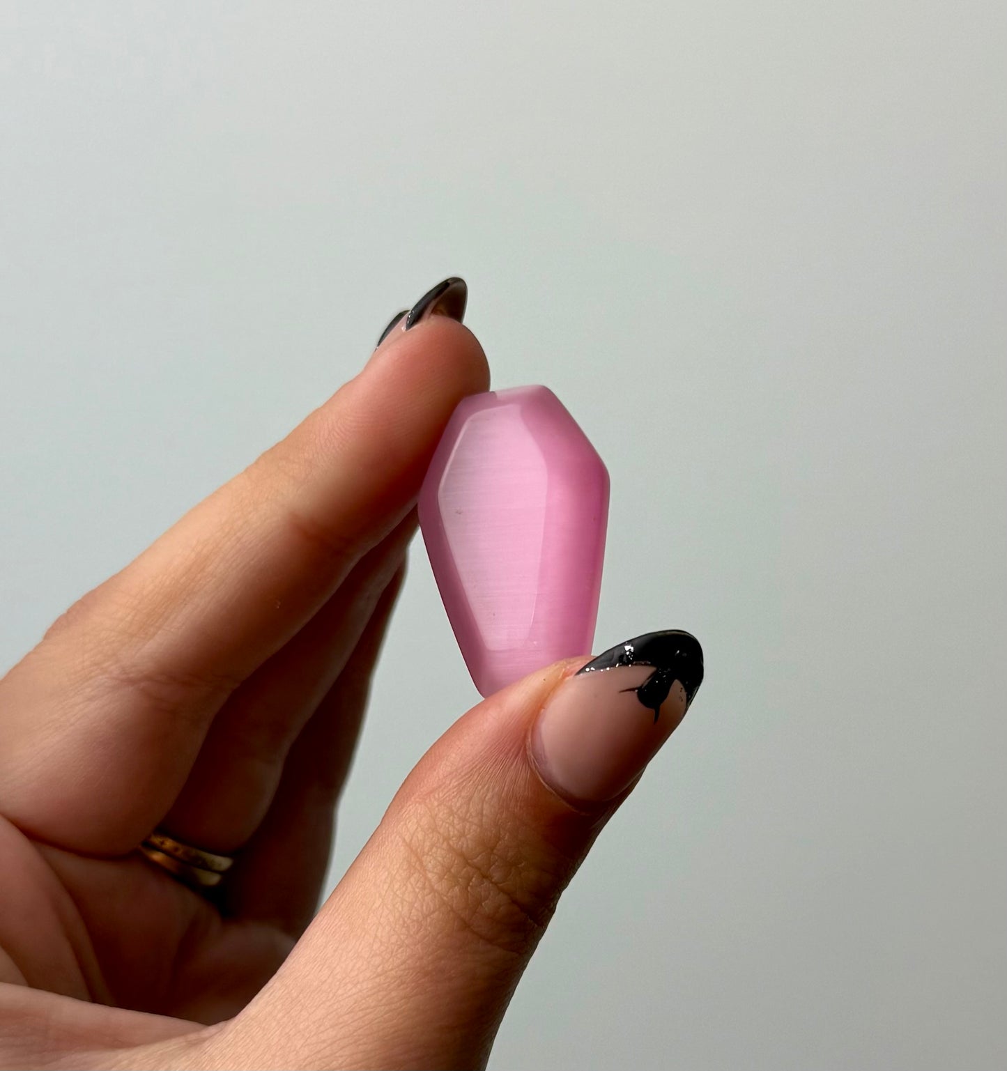 Man made material cats eye coffin carving