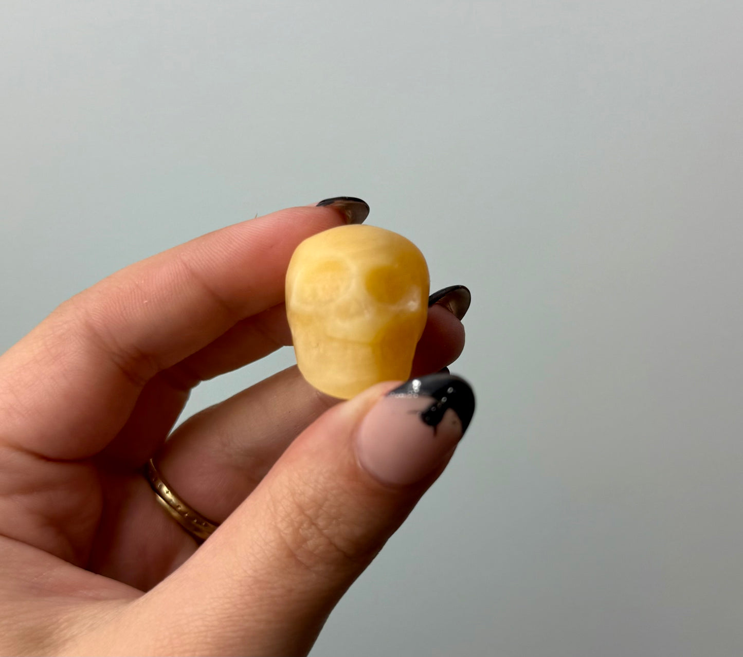Orange calcite skull carving