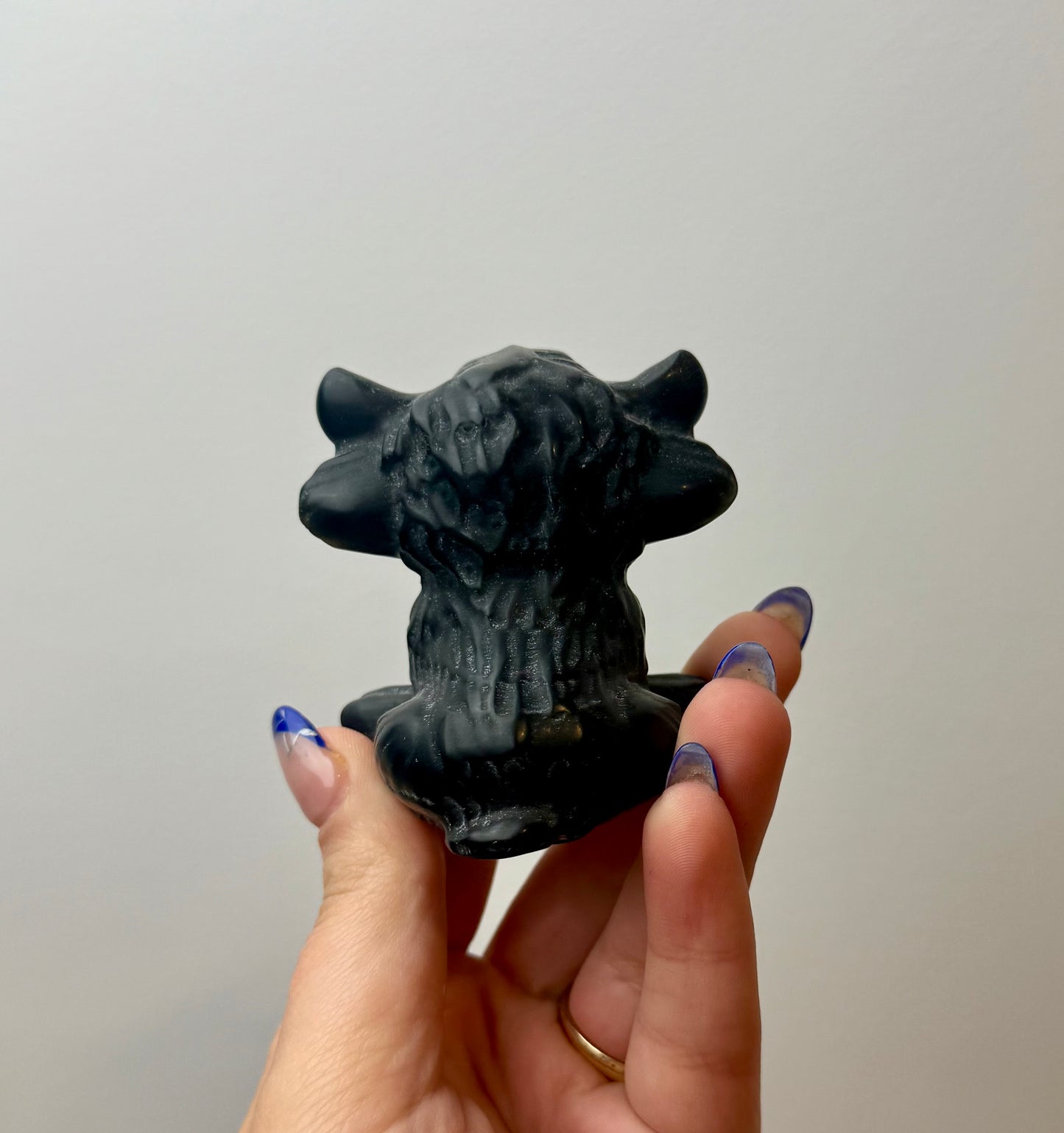 Obsidian cow carving