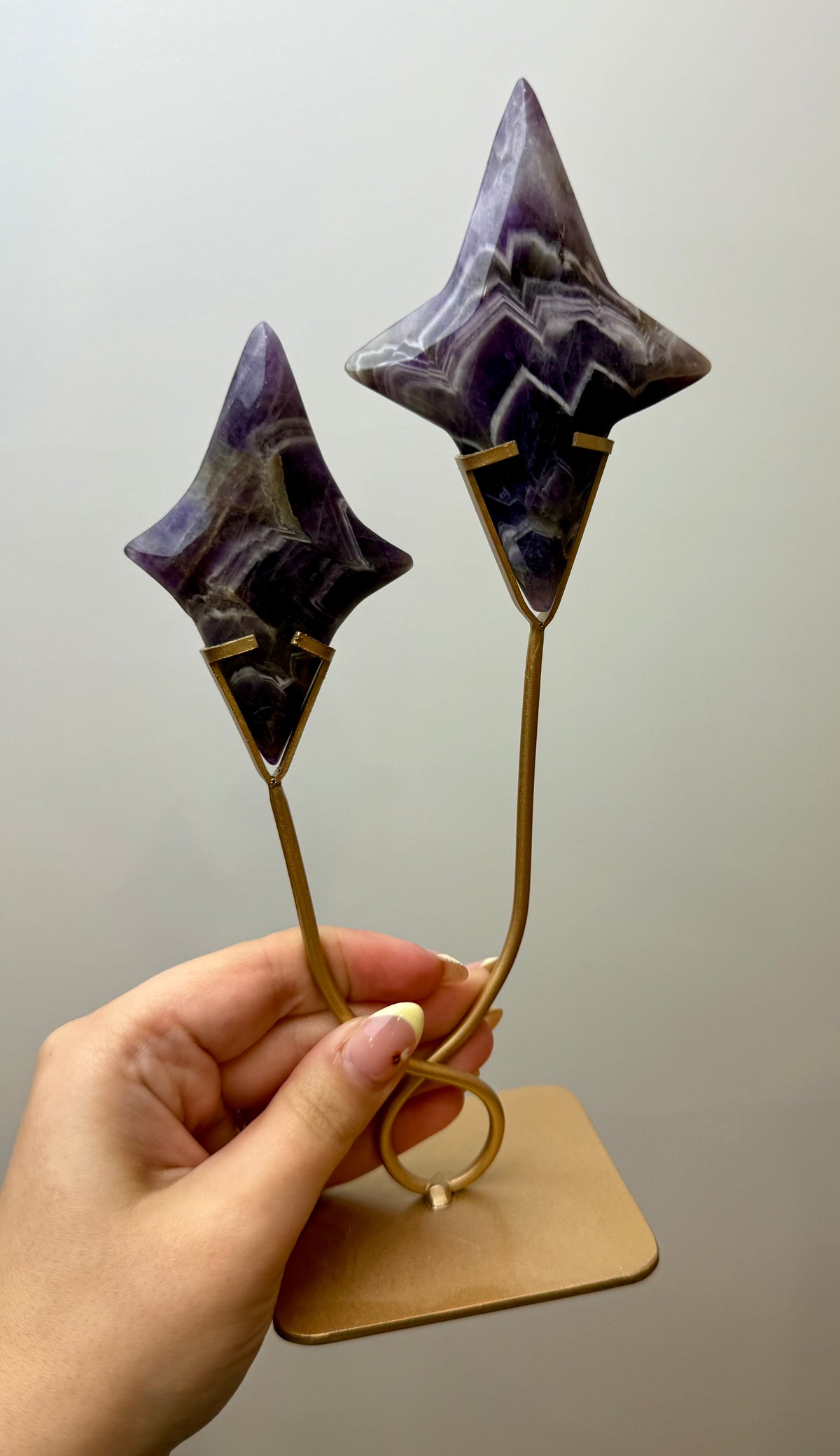 Dream amethyst shooting star carving on a stand