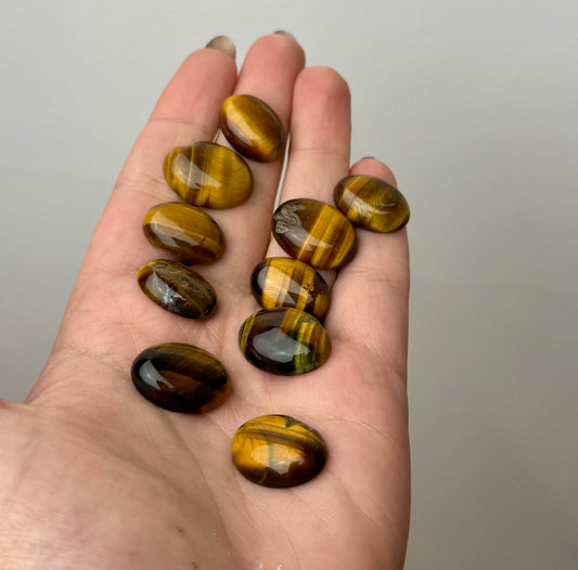 Tigers eye cabochon carvings