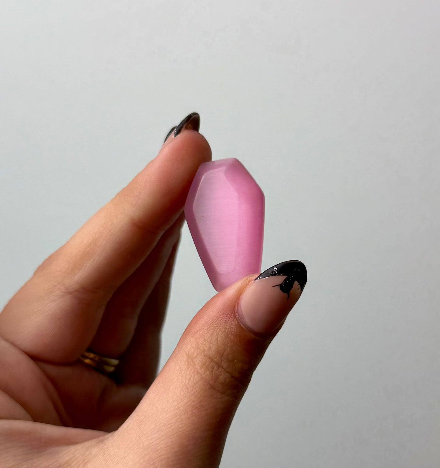 Man made material cats eye coffin carving