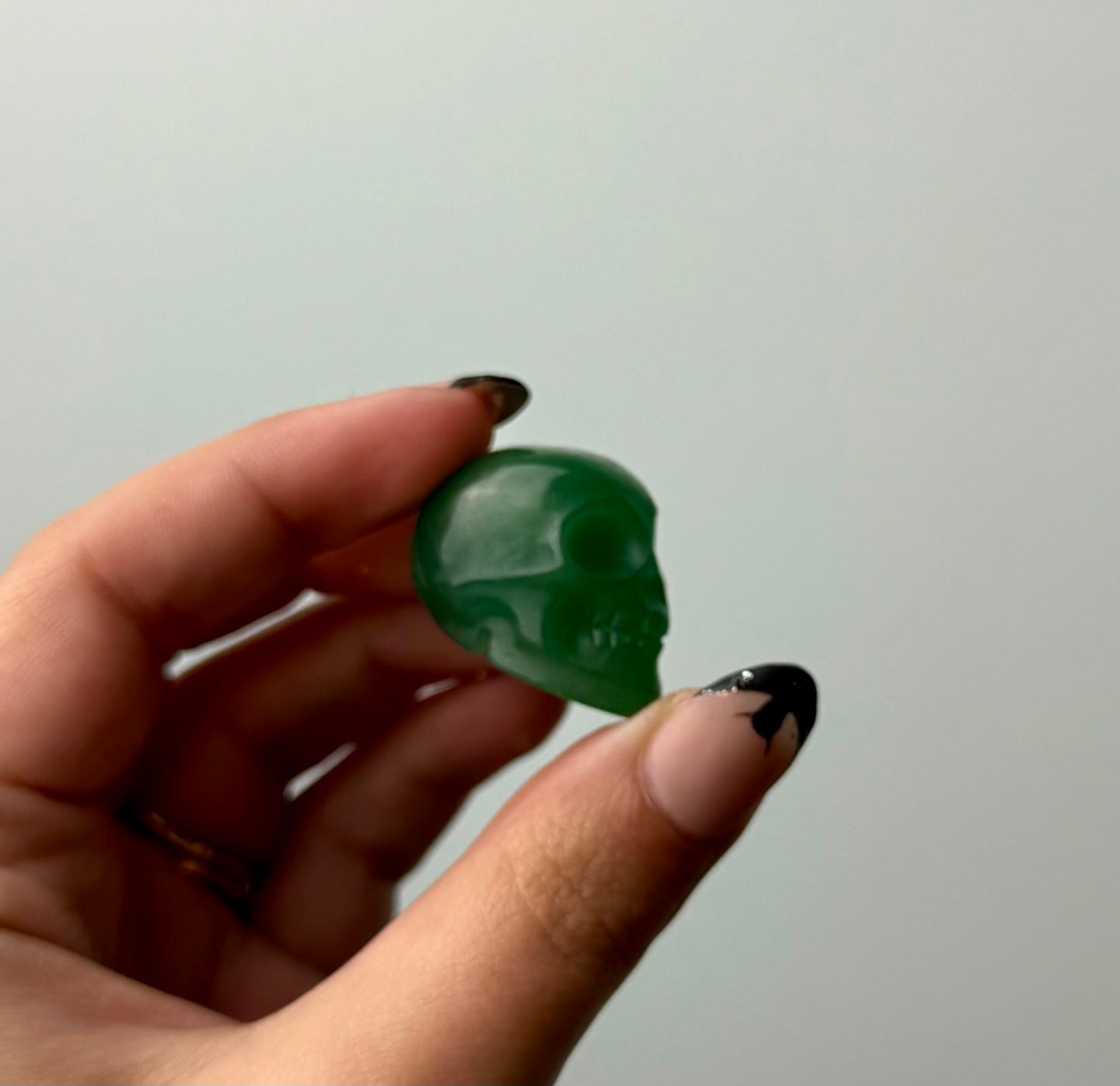 Green aventurine skull carving
