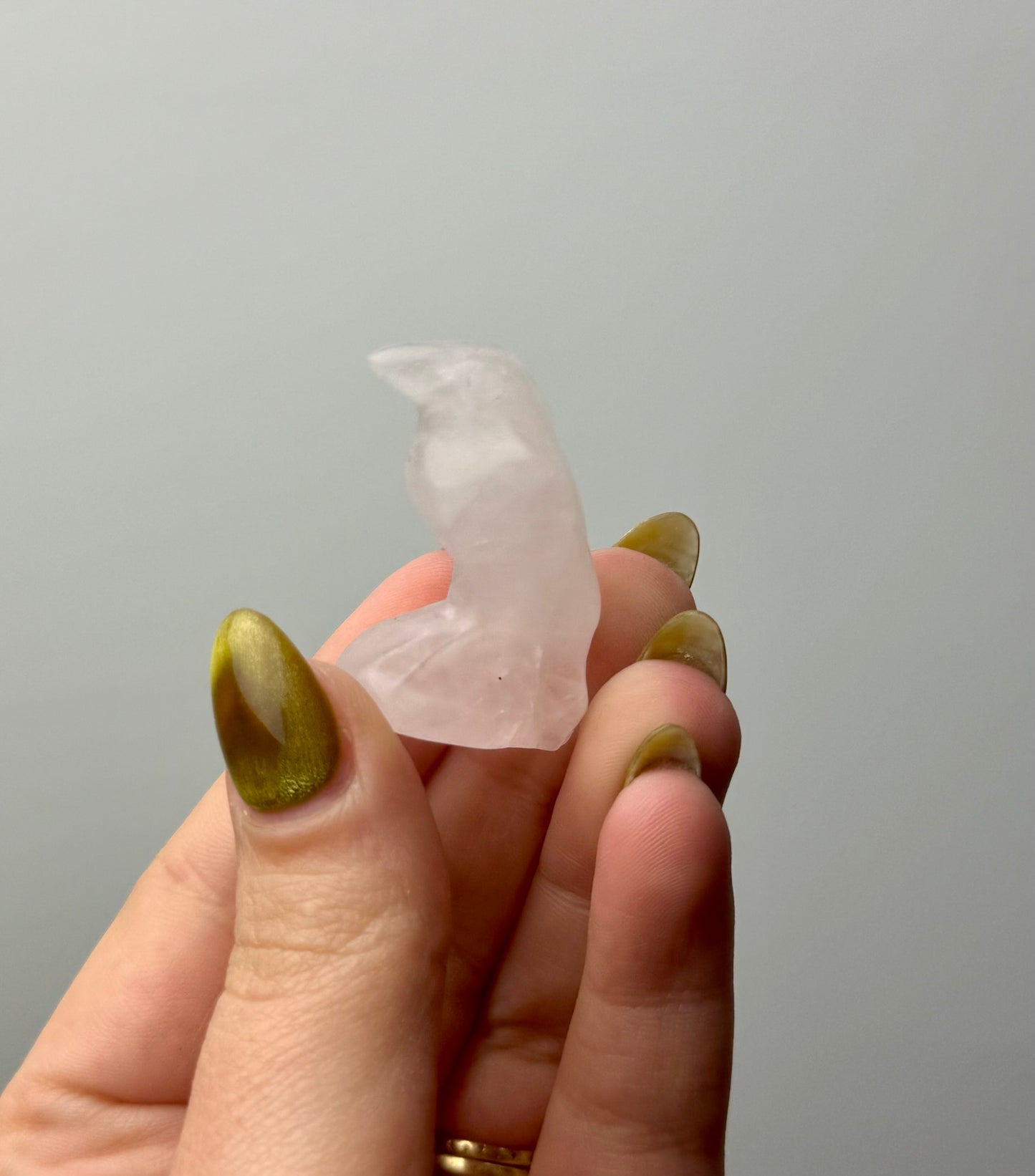 Rose quartz raven carving