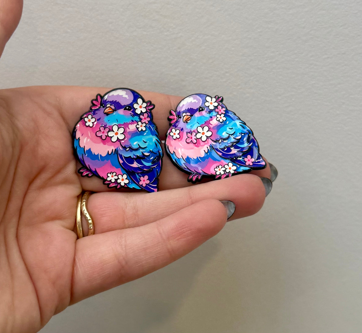 Colourful pigeon enamel pins