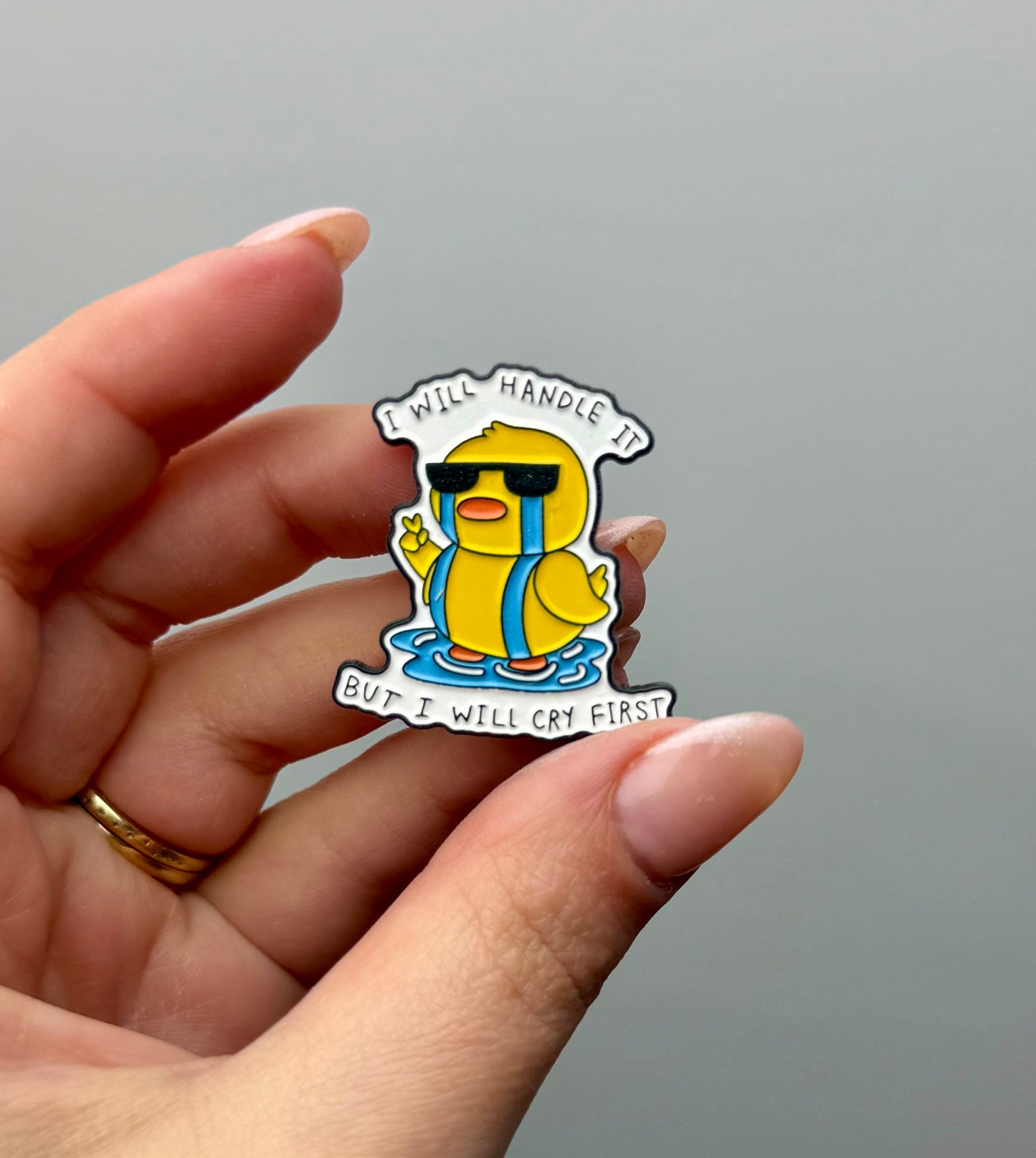 Cry first duck enamel pin