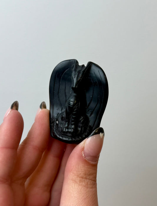 Obsidian dragon carving