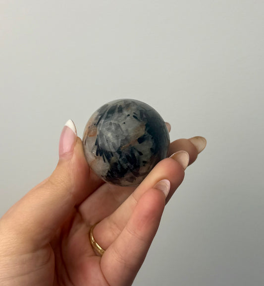 Black tourmaline in quartz sphere