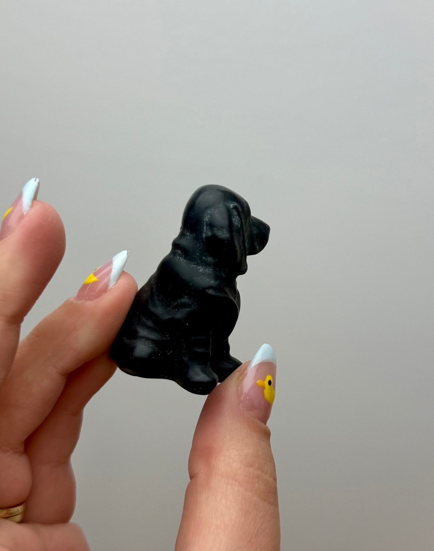 Obsidian dog carving