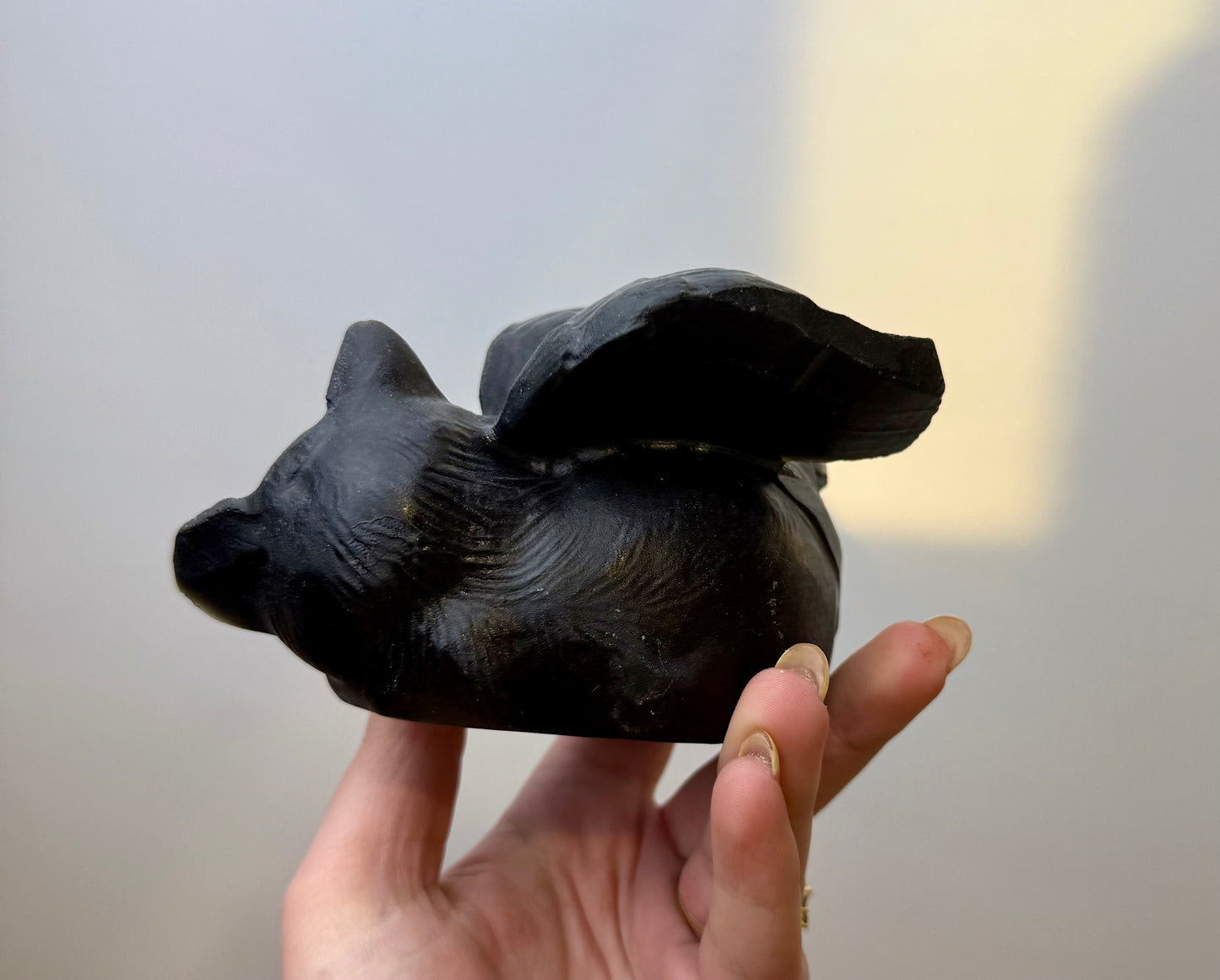 Obsidian angel cat carving