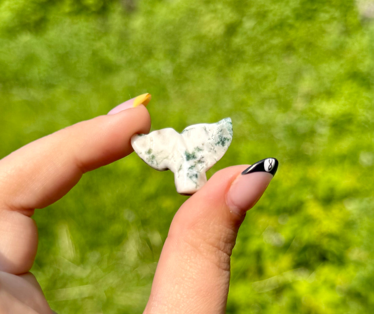 Moss agate whale tail carving