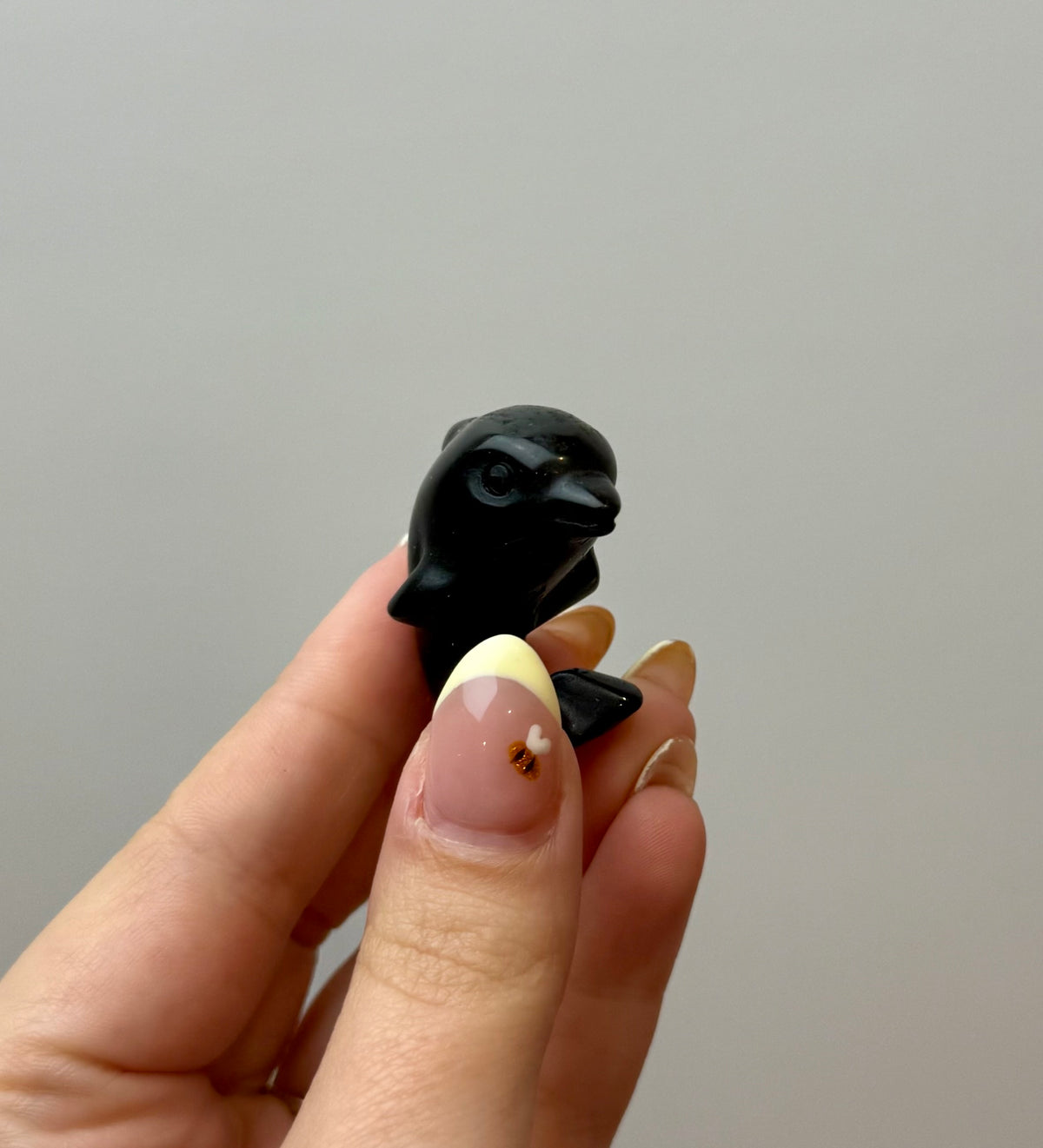 Obsidian dolphin carving