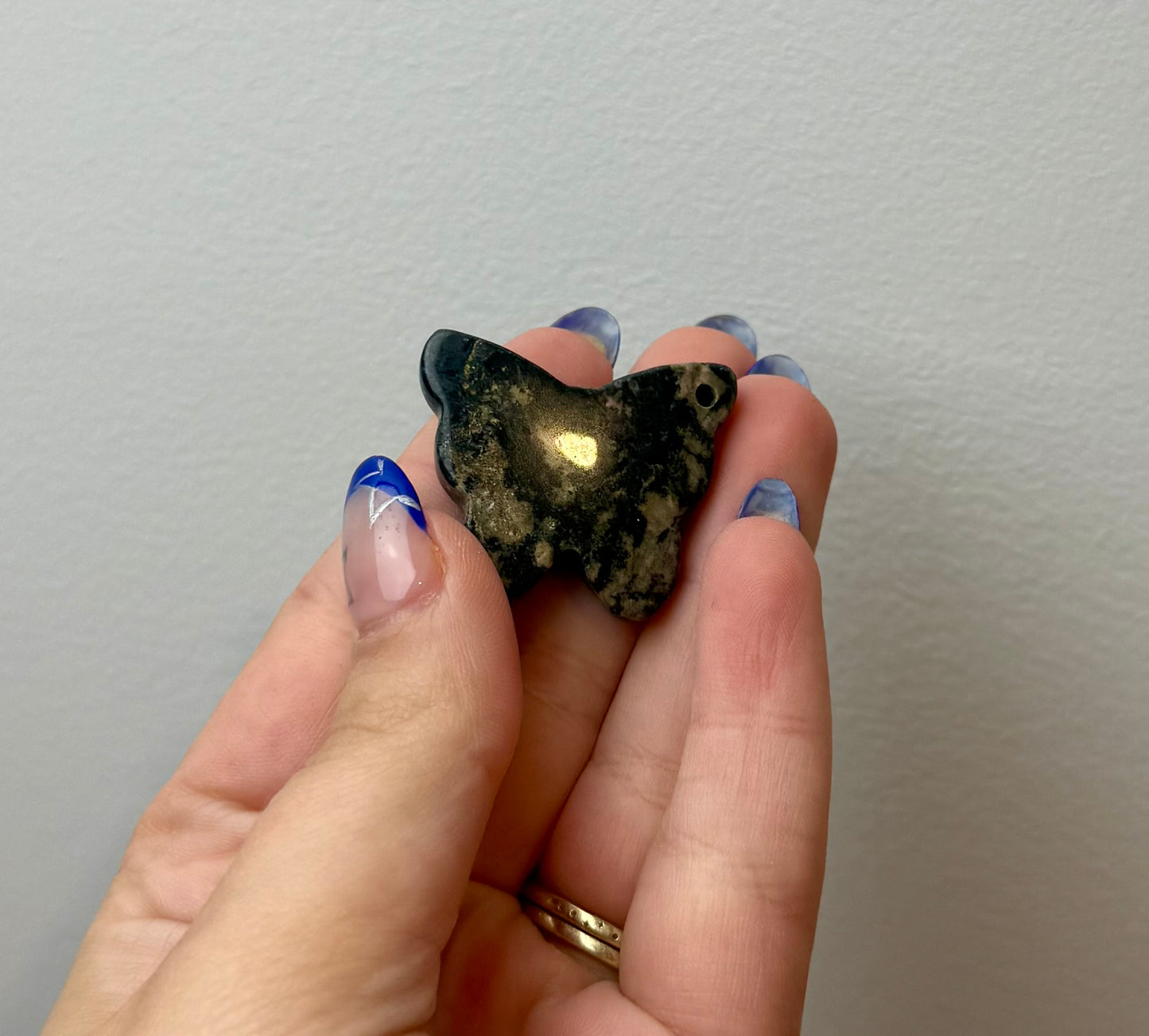 Moody rhodonite butterfly carving