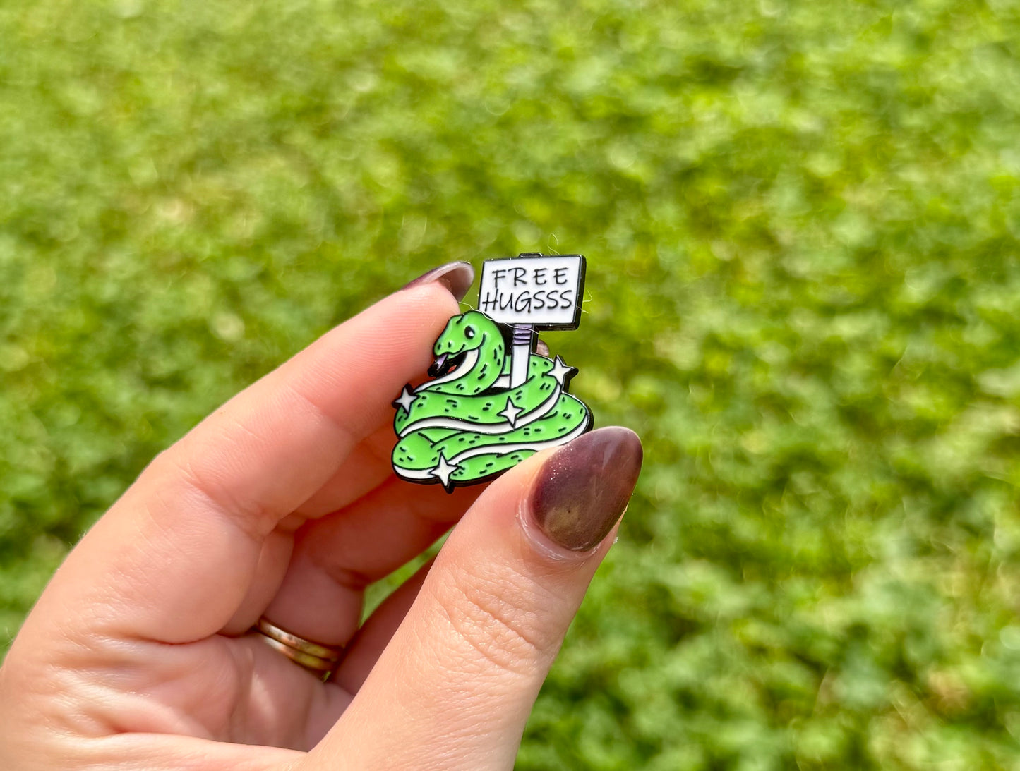 Snake free hugs enamel pin