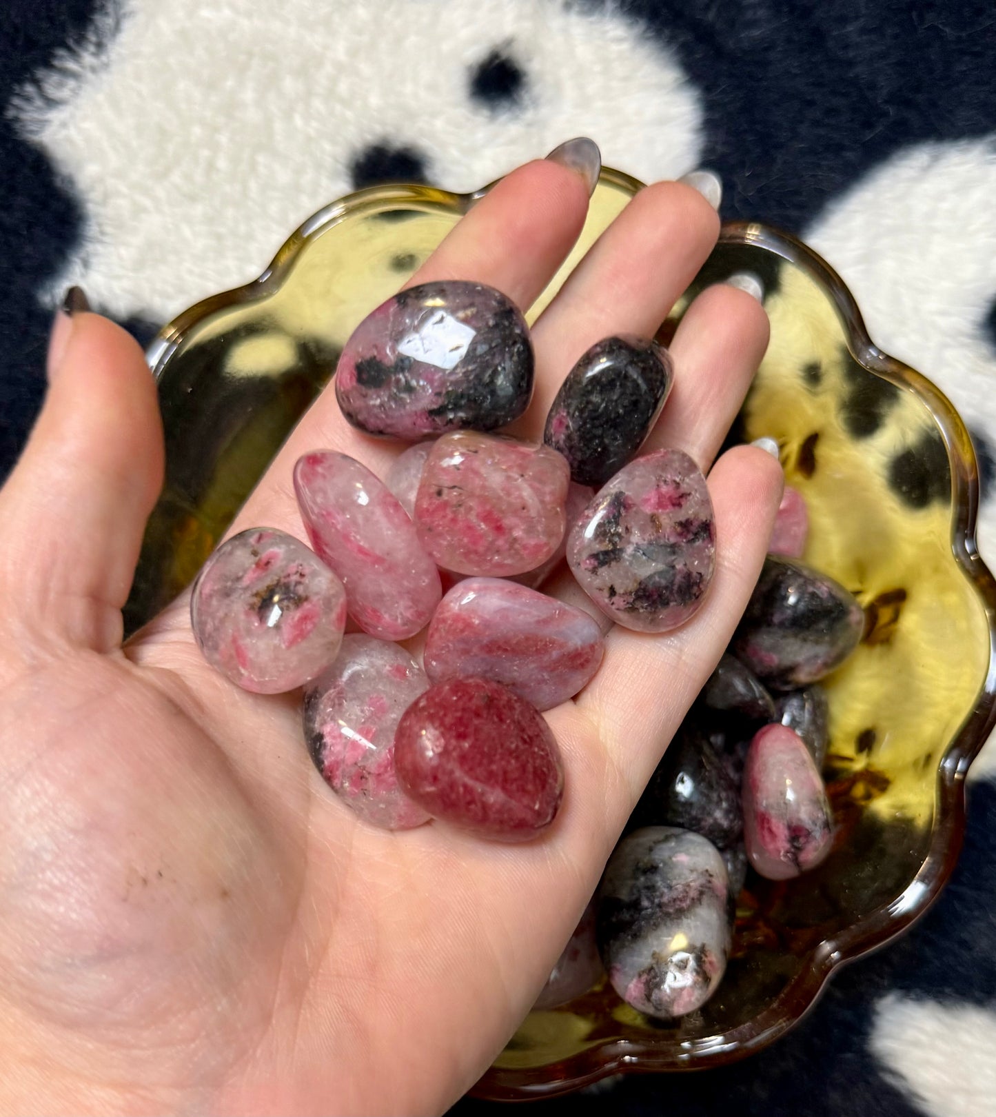 Icy rhodonite tumbles
