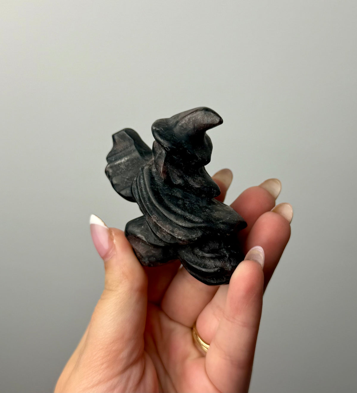 Flying witch carving