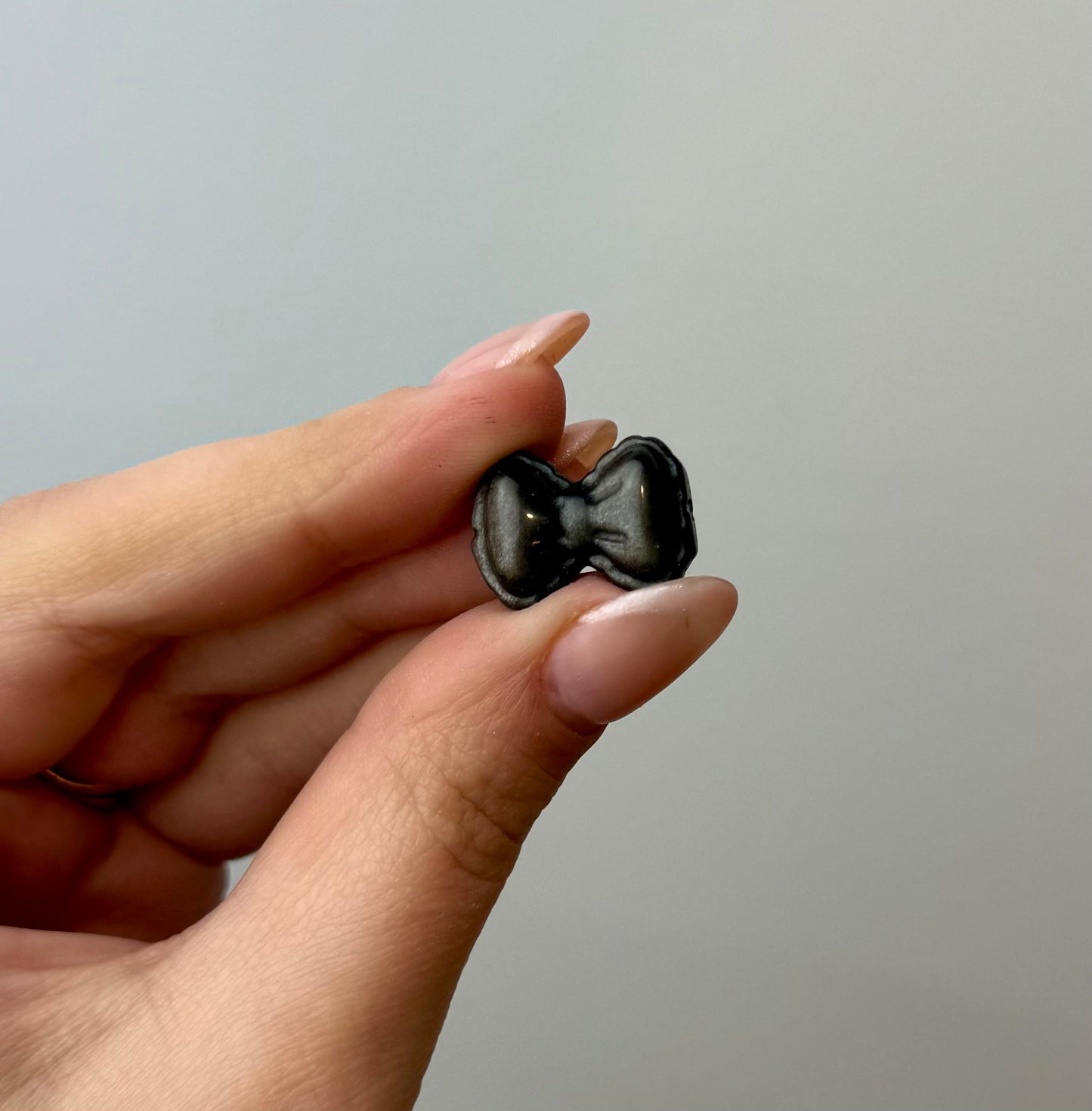 Silver obsidian bow carvings