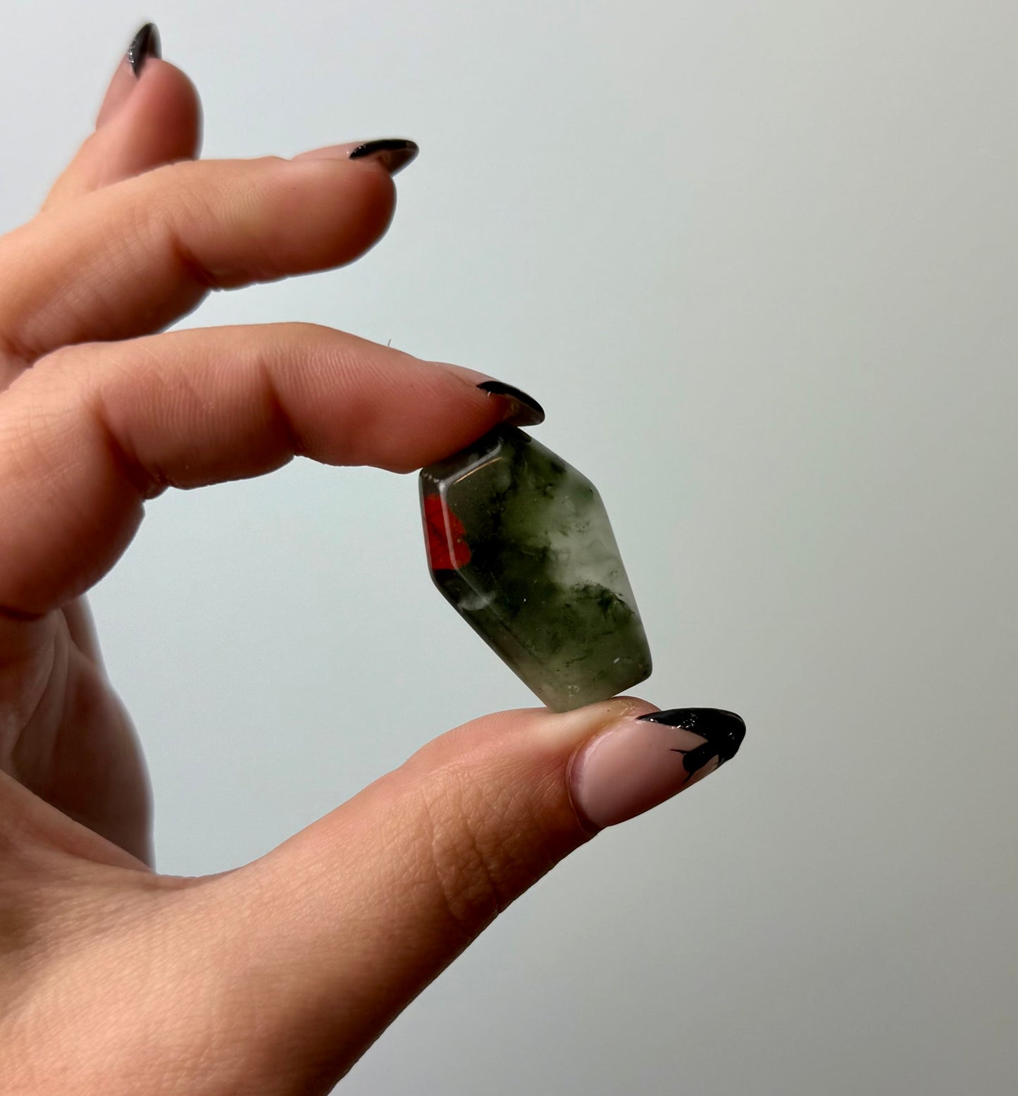 Bloodstone coffin carving