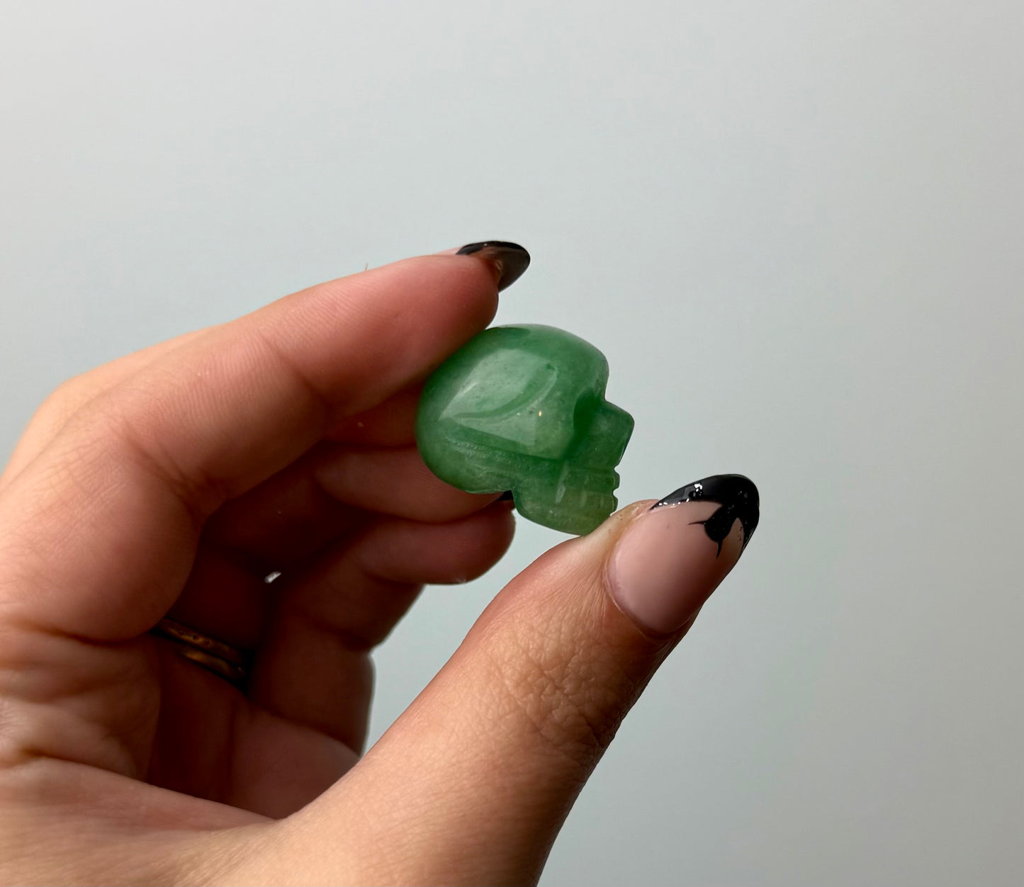 Green aventurine skull carving