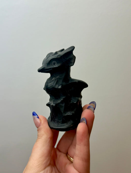 Obsidian dragon carving