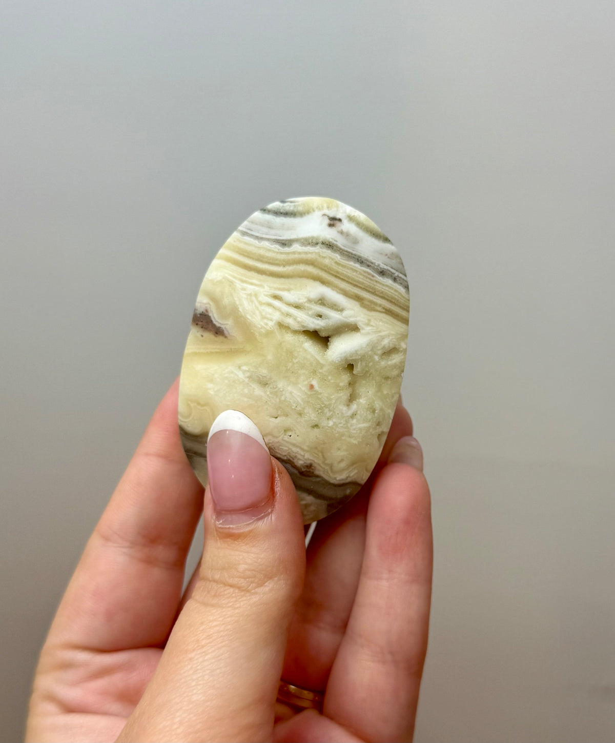Zebra calcite palm stone