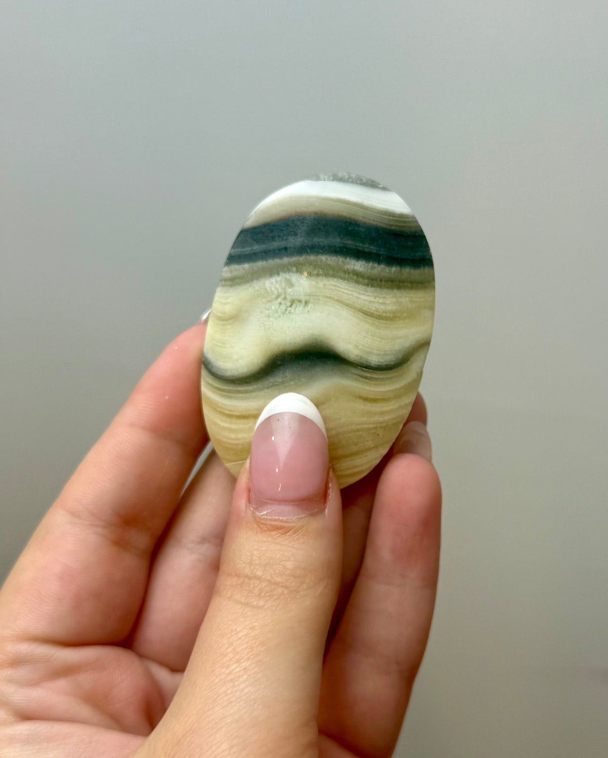 Zebra calcite palm stone