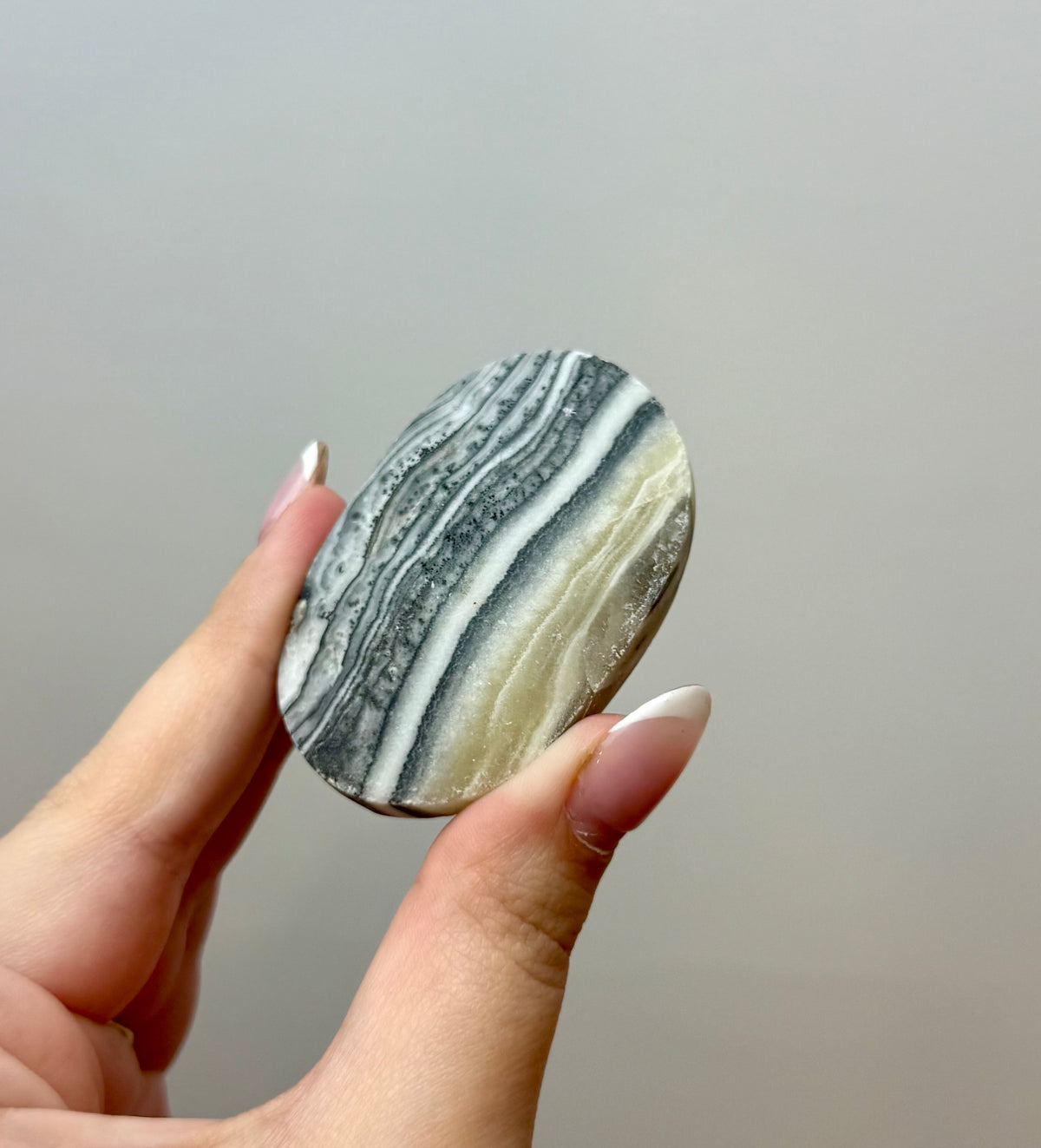 Zebra calcite palm stone