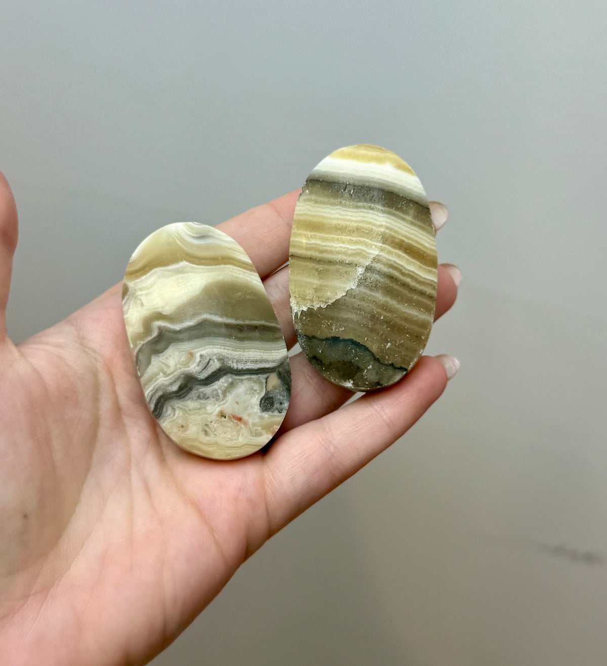 Zebra calcite palm stones